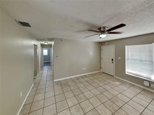a view of an empty room and window
