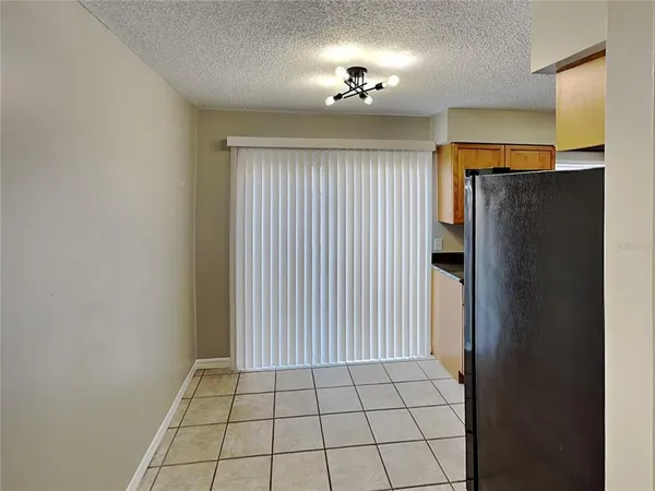 a view of an empty room with a mirror