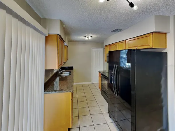 a hallway with a washer and dryer
