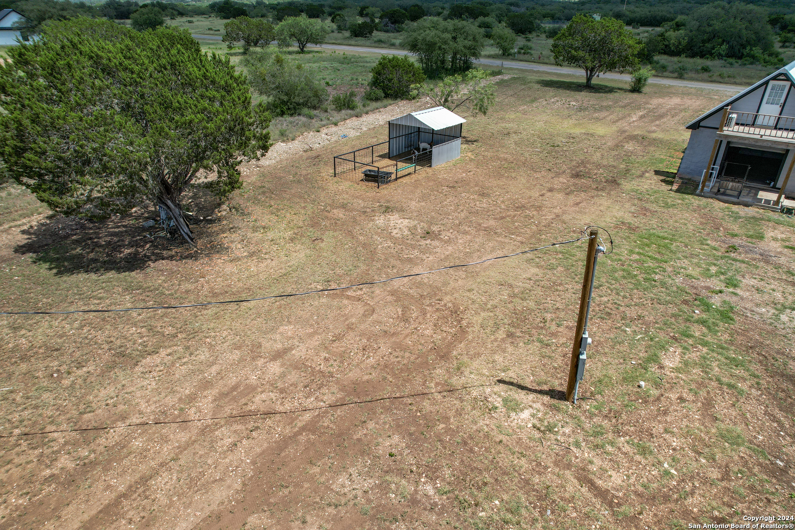 136 Cardinal Drive Camp Wood, TX 78833 - Photo 13 of 62 a backyard of a house with a yard and outdoor seating