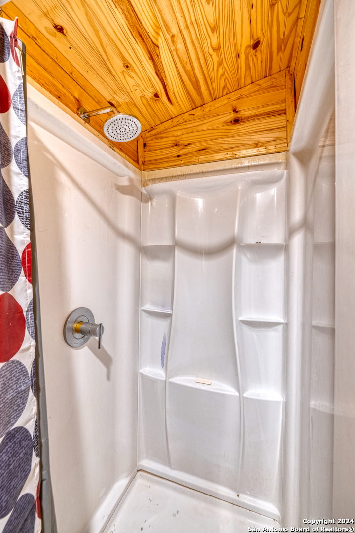 136 Cardinal Drive Camp Wood, TX 78833 - Photo 19 of 62 a bathroom with a shower