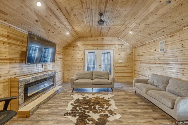 a bedroom with a bed and painting on the wall