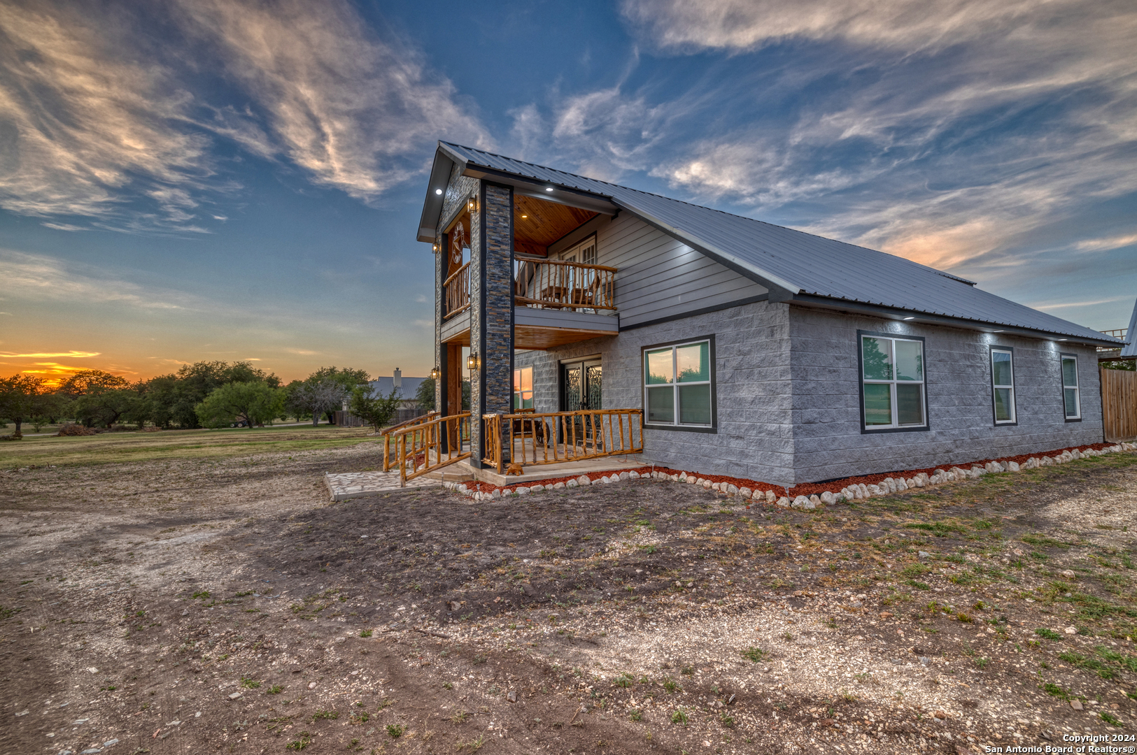 136 Cardinal Drive Camp Wood, TX 78833 - Photo 3 of 62 a view of a house with backyard and trees