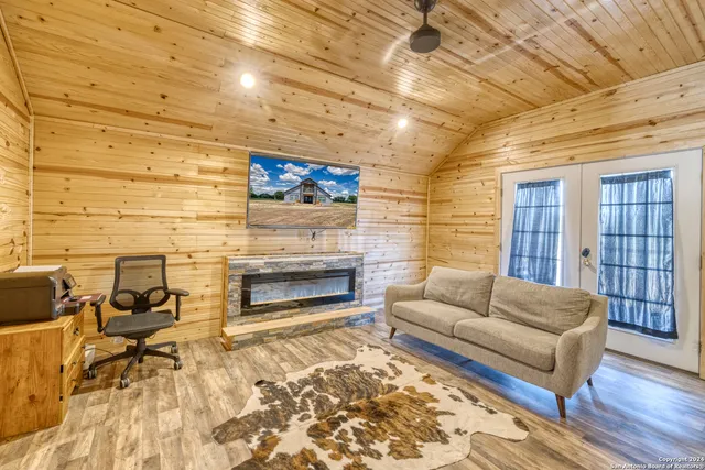 a bedroom with two beds and lamps