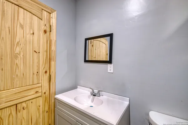 a kitchen with a sink and cabinets