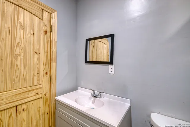 a kitchen with a sink and cabinets