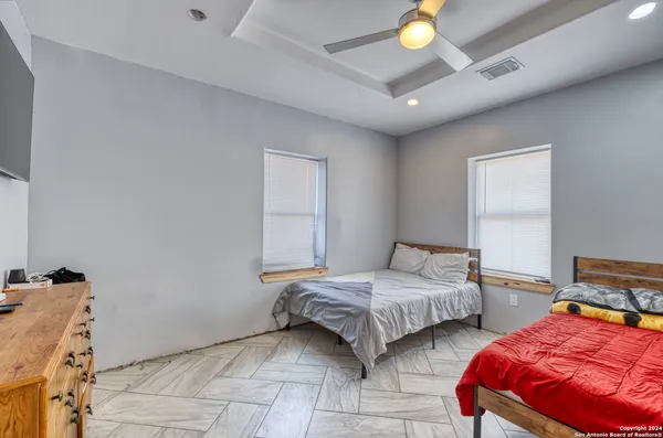 a view of a lounge chairs in the back yard of the house