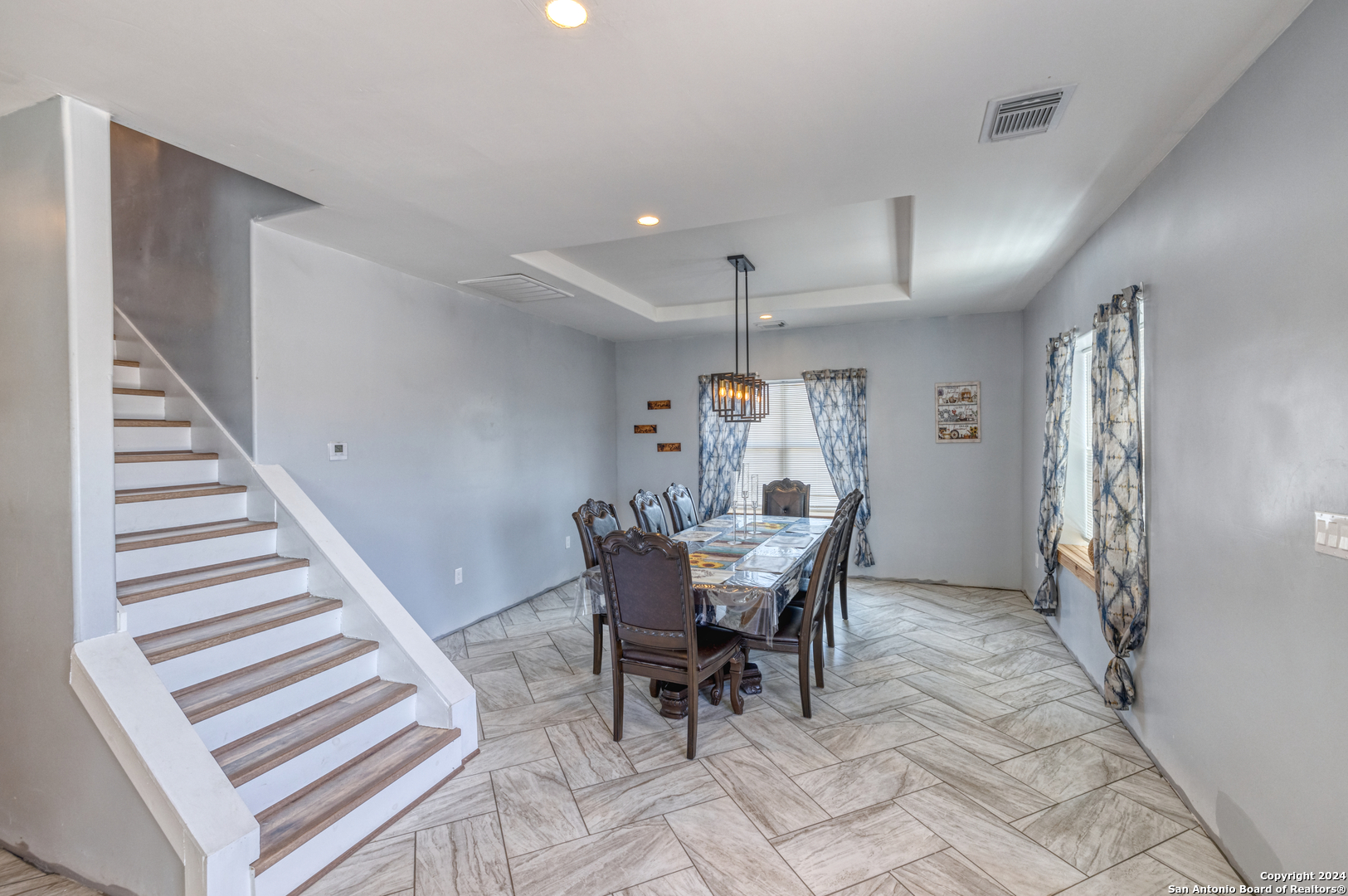 136 Cardinal Drive Camp Wood, TX 78833 - Photo 42 of 62 a view of a dining room with furniture and wooden floor