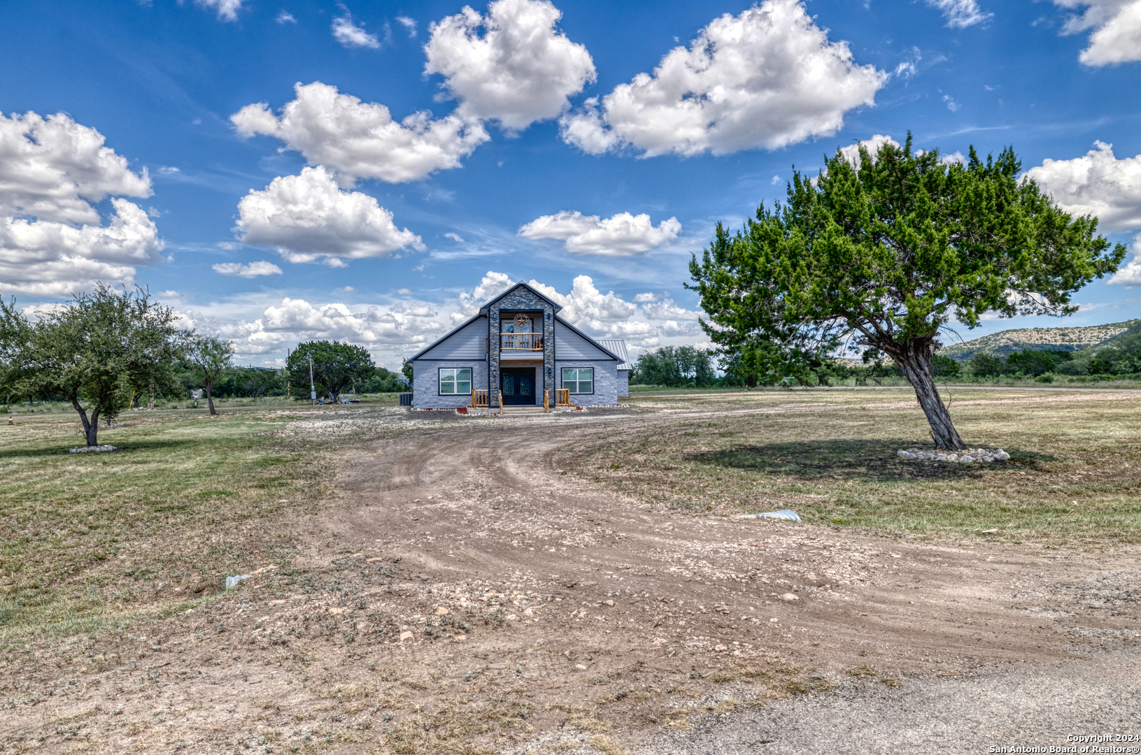 136 Cardinal Drive Camp Wood, TX 78833 - Photo 54 of 62 a view of the house and outdoor space