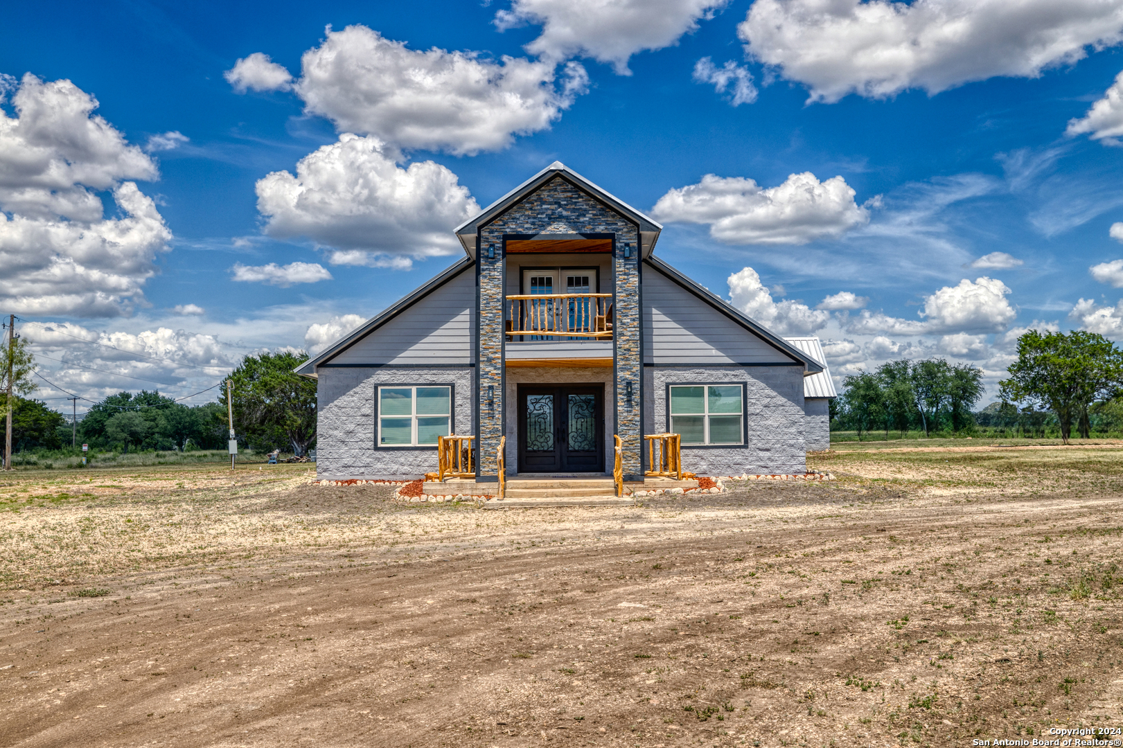 136 Cardinal Drive Camp Wood, TX 78833 - Photo 55 of 62 a front view of a house with a yard