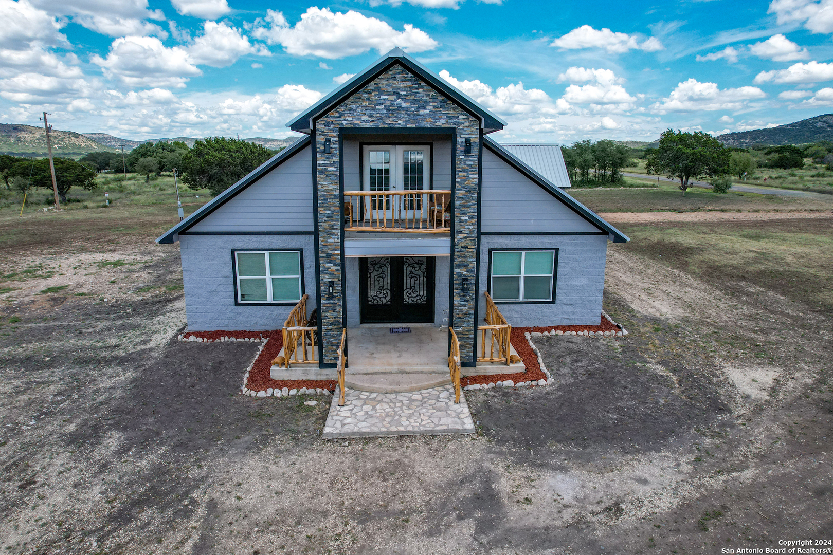 136 Cardinal Drive Camp Wood, TX 78833 - Photo 6 of 62 a view of house with backyard space and garden