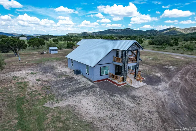 a view of a barn in a yard