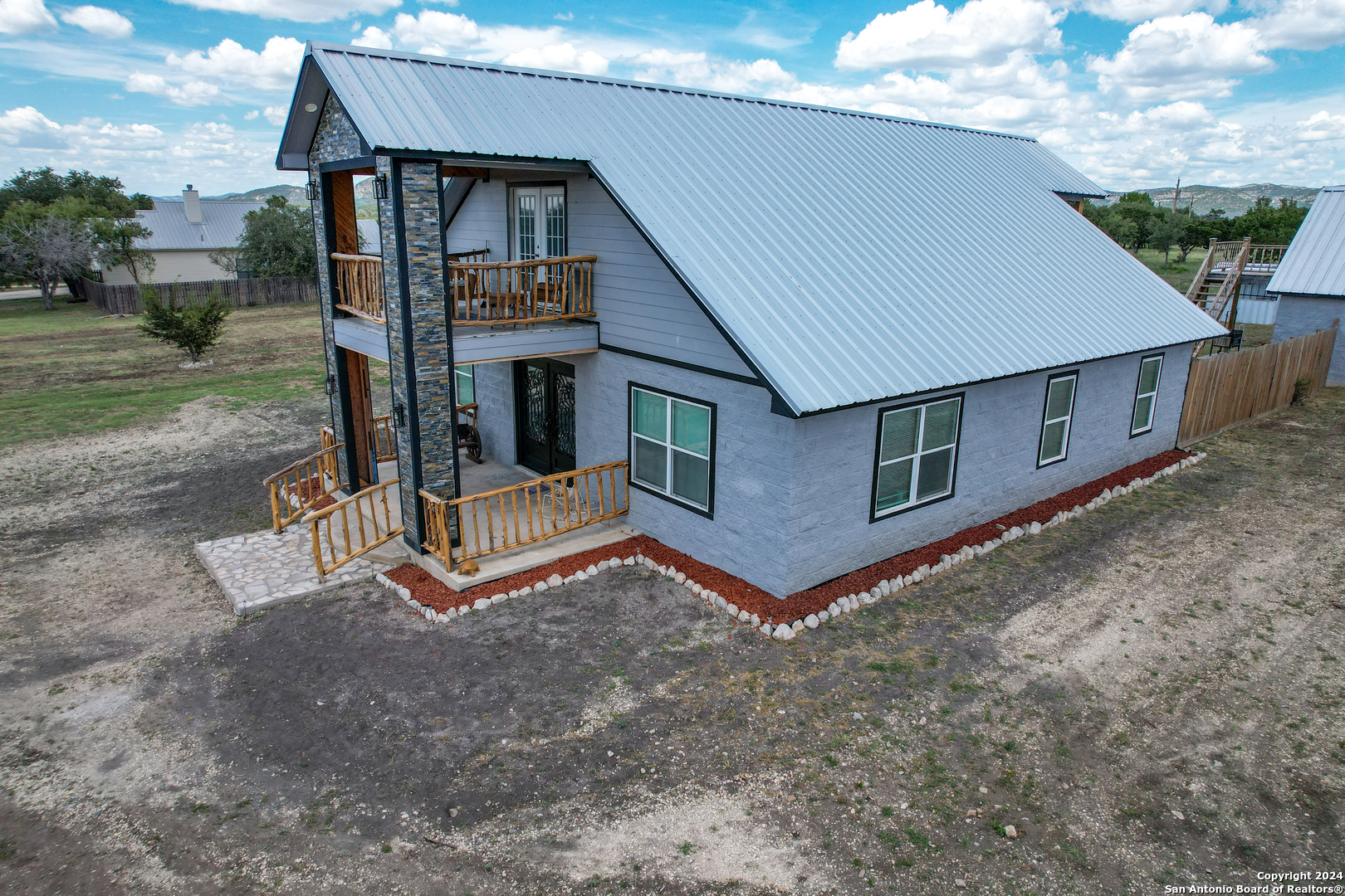 136 Cardinal Drive Camp Wood, TX 78833 - Photo 10 of 62 a view of a house with a yard