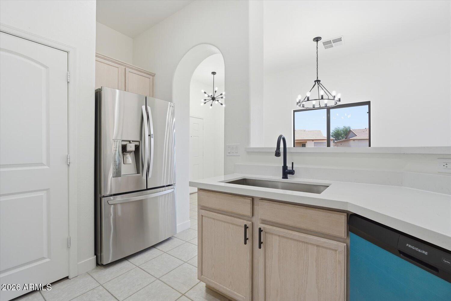 2565 South Signal Butte Road, Unit 23 Mesa, AZ 85209 - Photo 10 of 29 a kitchen with appliances a sink and cabinets