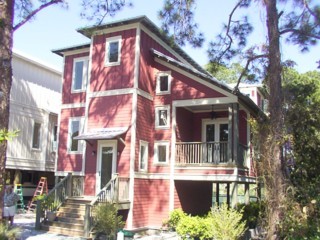 a front view of a multi story building with yard