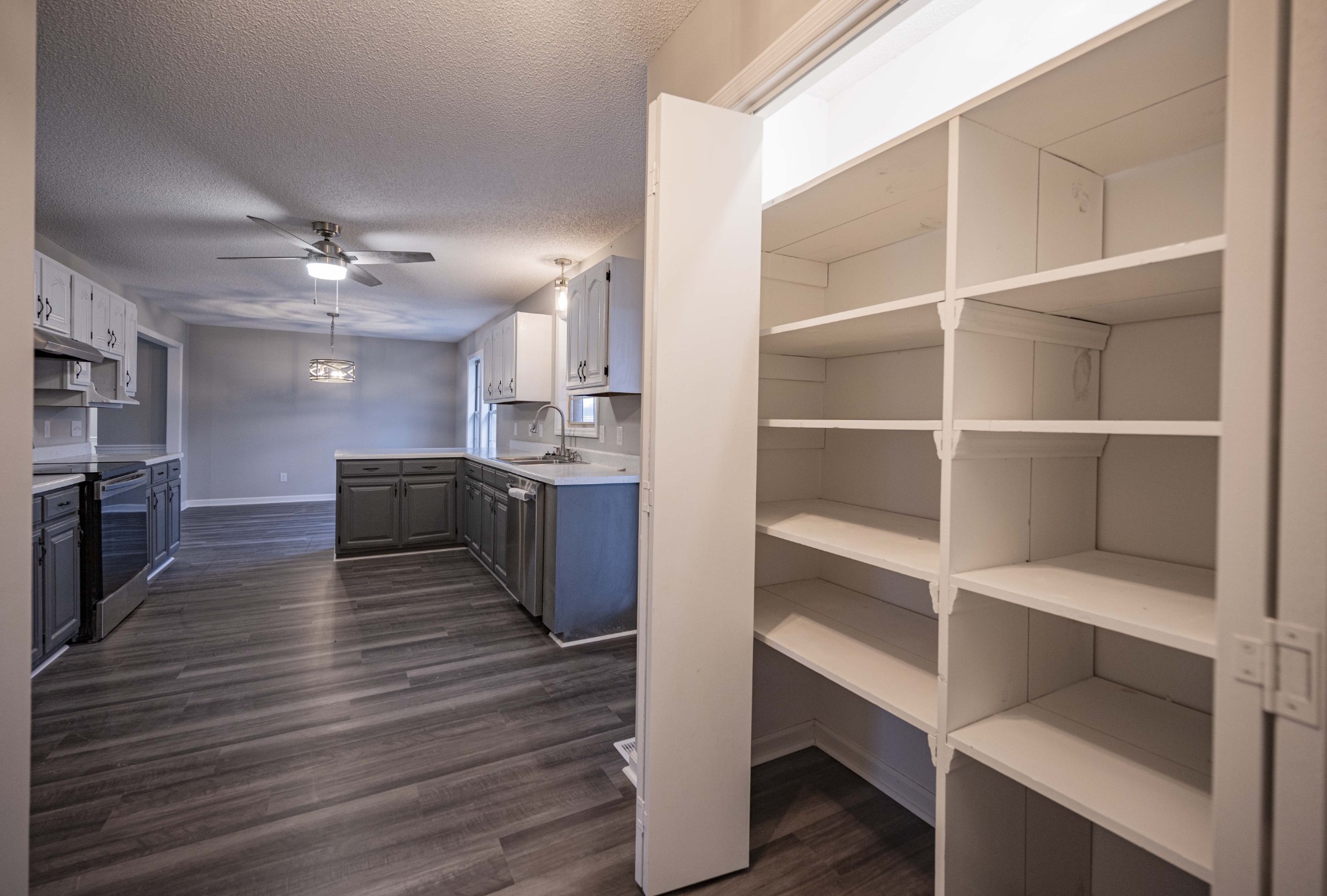 565 Adamson Branch Road Liberty, TN 37095 - Photo 17 of 28 a view of kitchen with cabinets and wooden floor