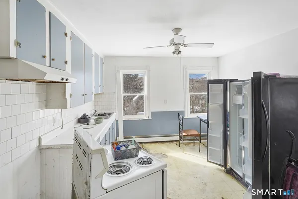 a view of a kitchen with sink cabinets and window