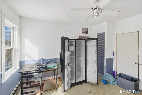 a bathroom with a toilet and a mirror