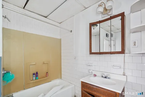 a view of livingroom with furniture and workspace