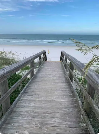 a view of a house with wooden balcony