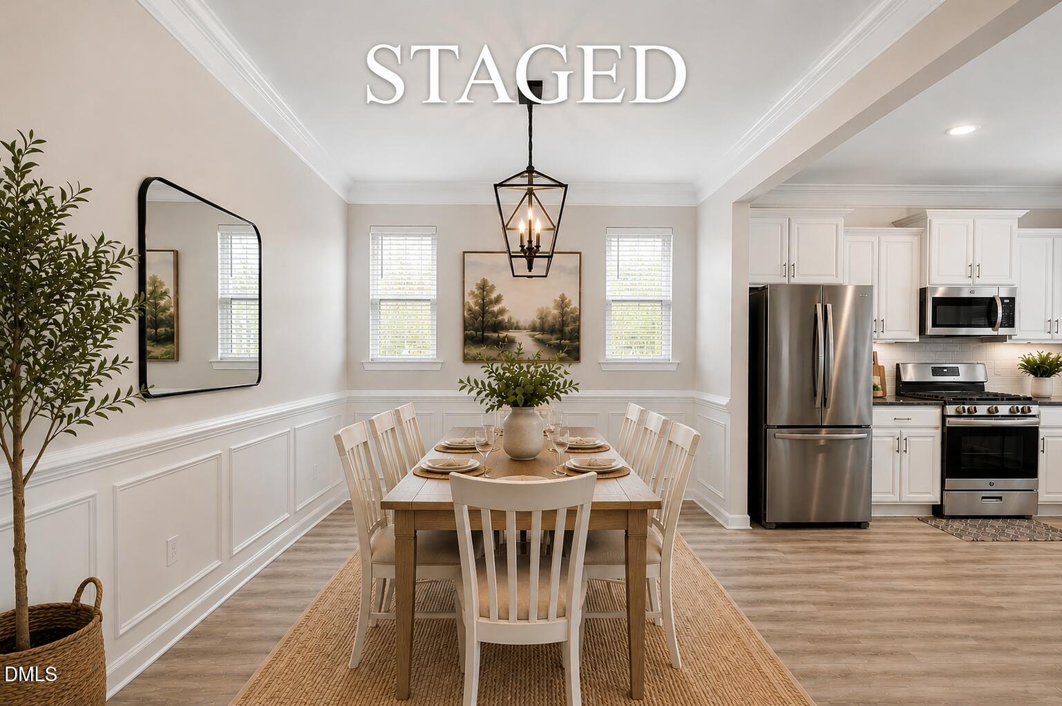 364 Springtime Fields Lane Wake Forest, NC 27587 - Photo 13 of 63 a dining room with furniture a chandelier and wooden floor