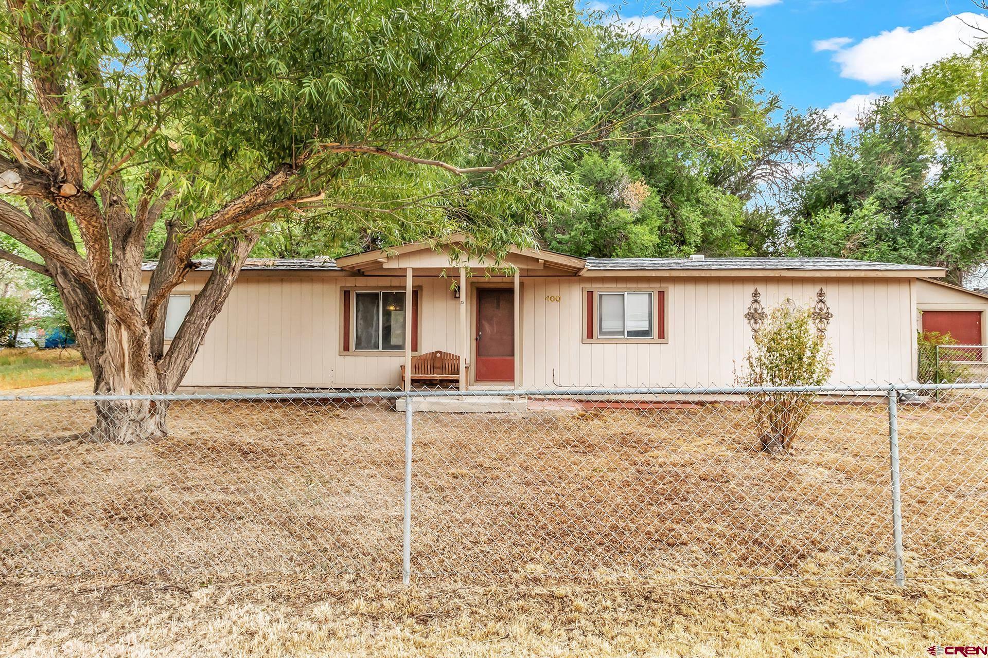 400 Riley Lane Delta, CO 81416 - Photo 1 of 35 front view of a house with a yard