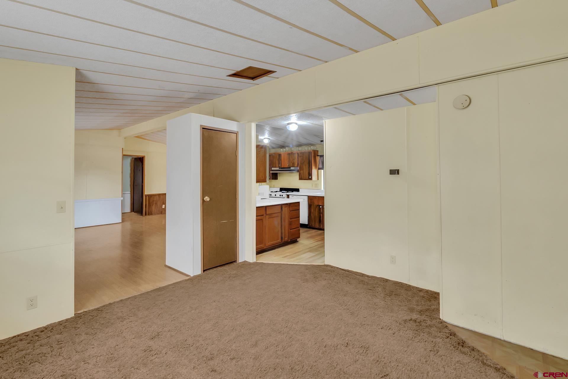 400 Riley Lane Delta, CO 81416 - Photo 16 of 35 a view of a kitchen with a refrigerator and a sink