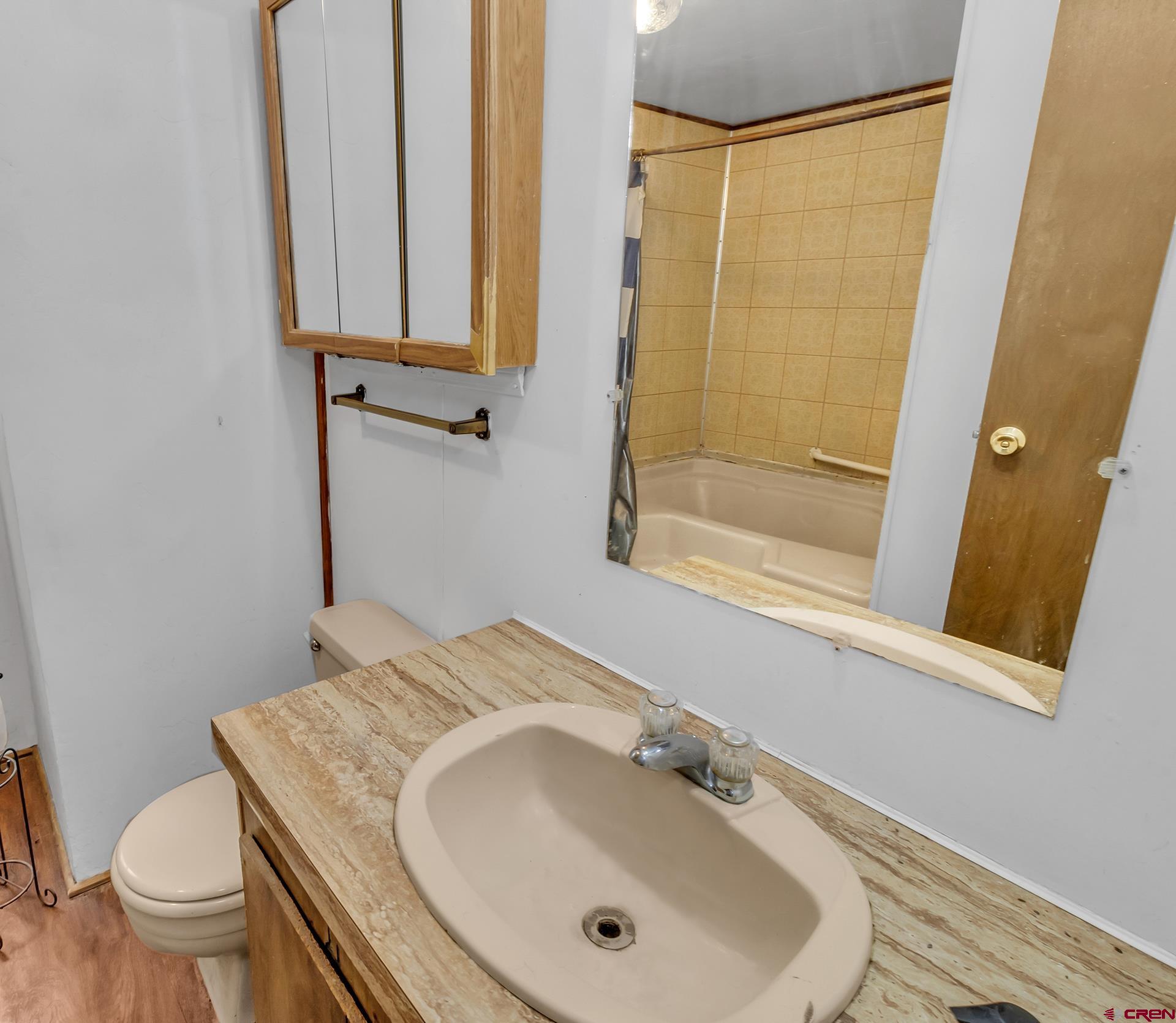 400 Riley Lane Delta, CO 81416 - Photo 20 of 35 a bathroom with a sink a toilet and shower