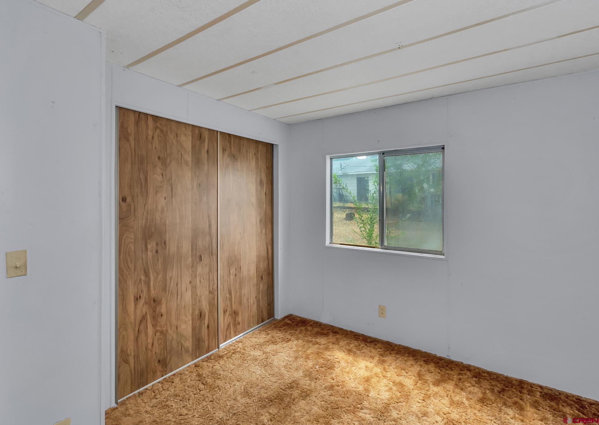 400 Riley Lane Delta, CO 81416 - Photo 23 of 35 a view of room with window and hardwood floor