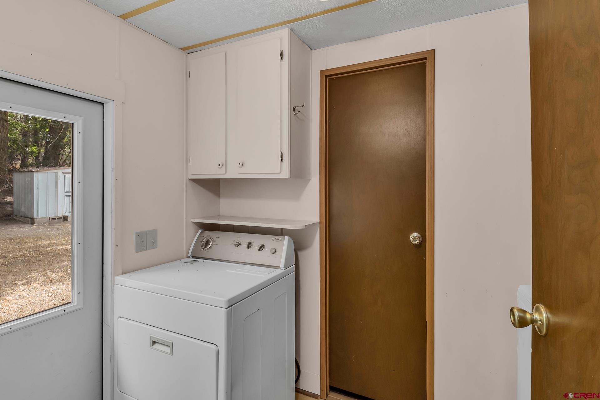 400 Riley Lane Delta, CO 81416 - Photo 27 of 35 a utility room with dryer and washer