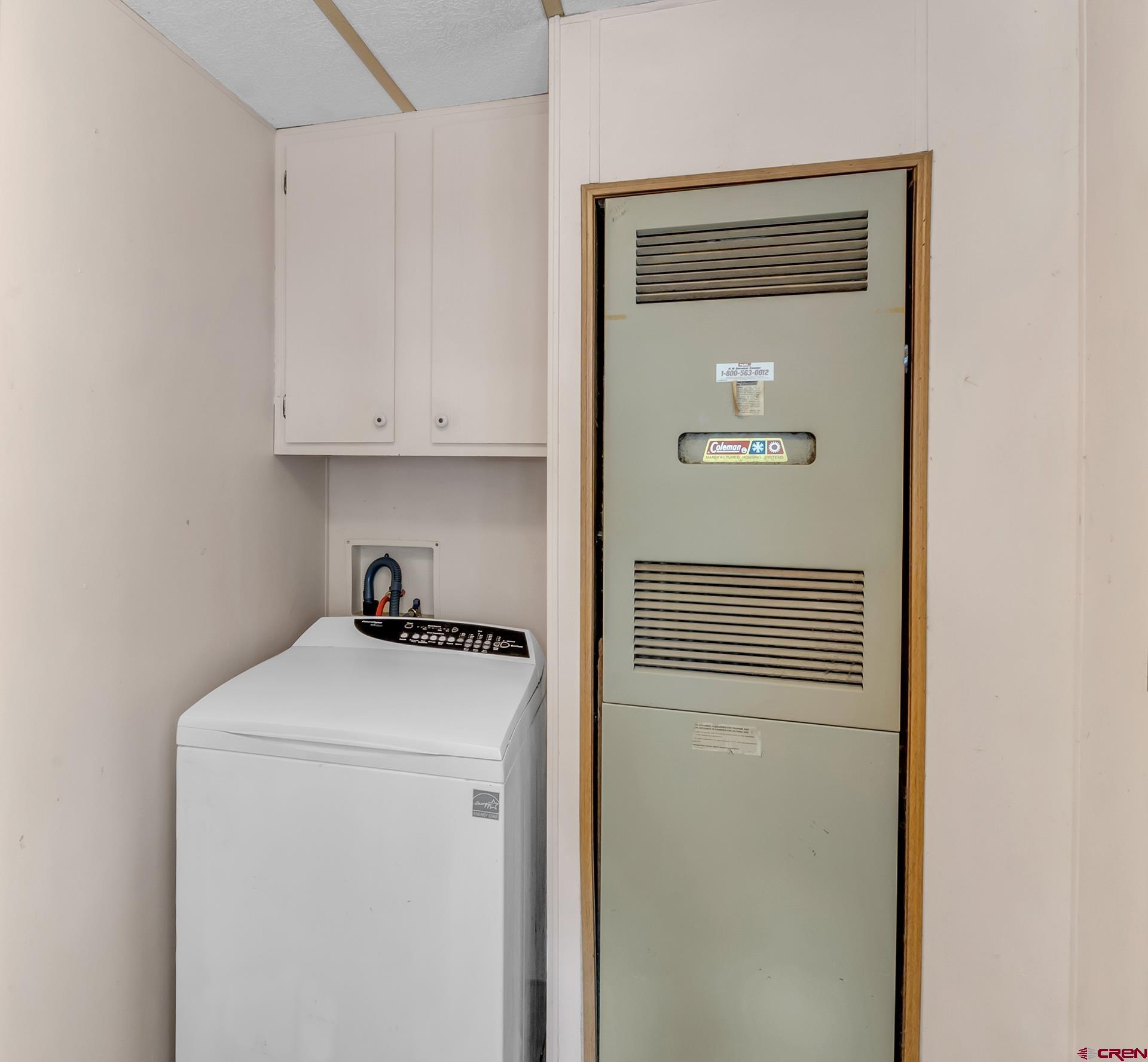 400 Riley Lane Delta, CO 81416 - Photo 28 of 35 a view of a storage and utility room with washer and dryer