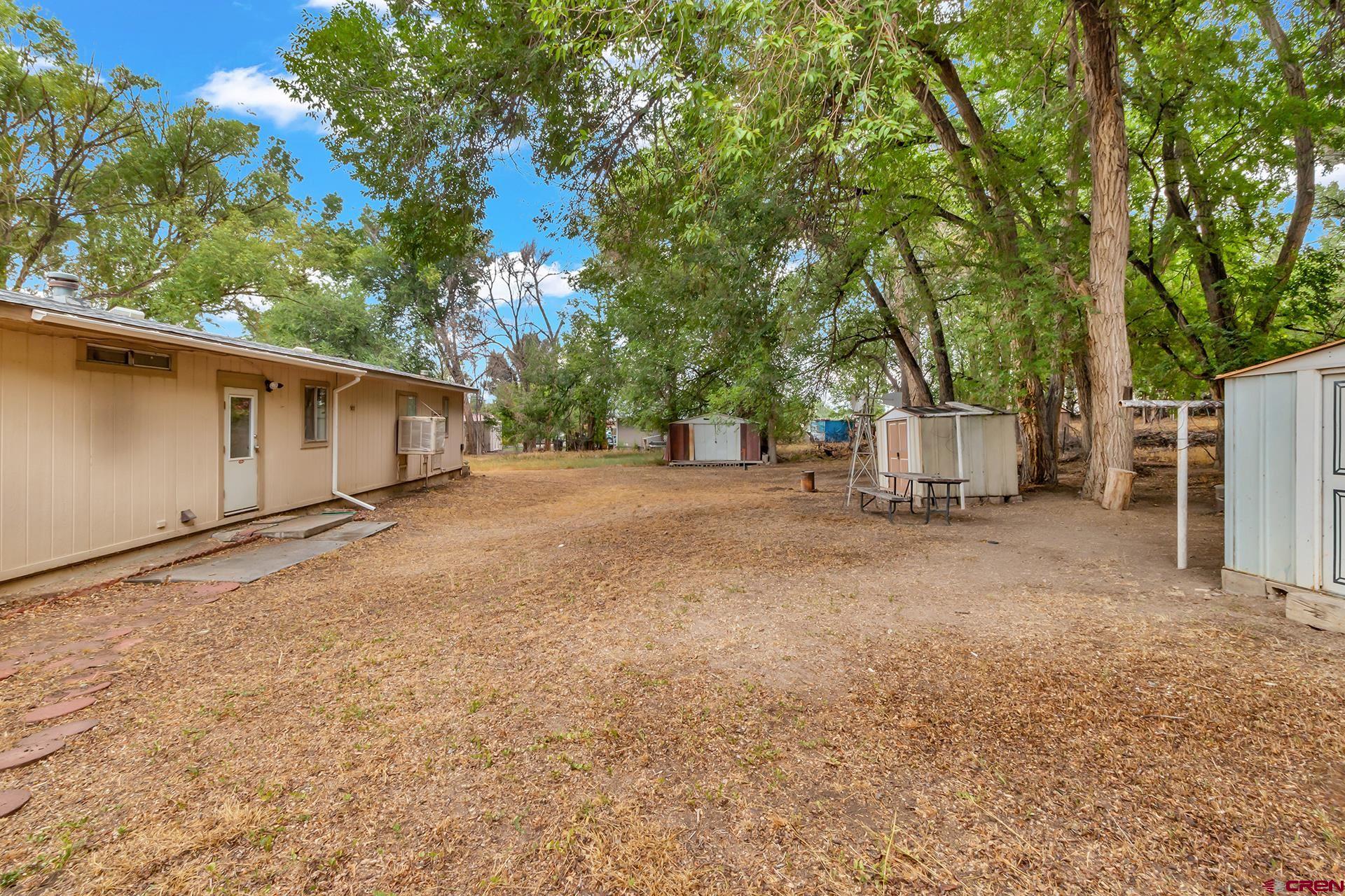 400 Riley Lane Delta, CO 81416 - Photo 30 of 35 a view of a house with a backyard