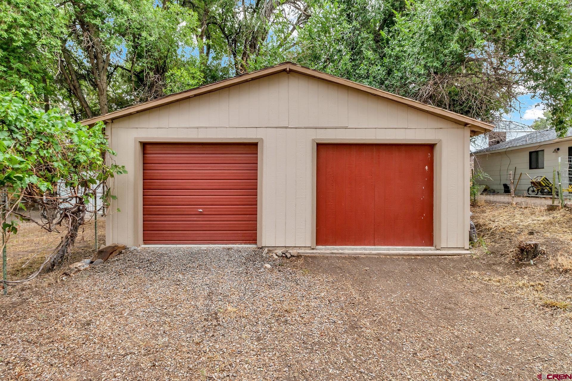 400 Riley Lane Delta, CO 81416 - Photo 3 of 35 a view of wooden house with a yard