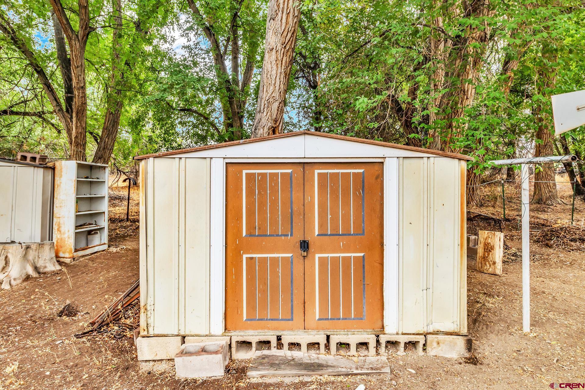 400 Riley Lane Delta, CO 81416 - Photo 33 of 35 a front view of a house with a yard
