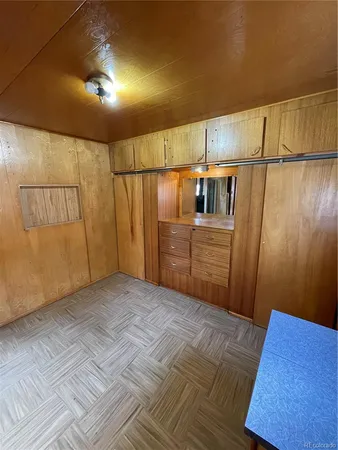 a bed room with a bed and a mirror