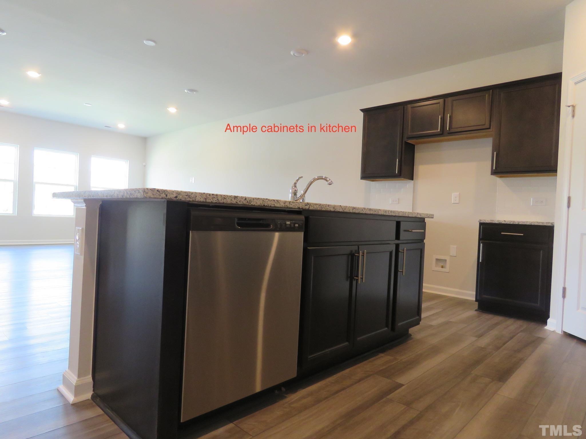 5118 Anamosa Street Raleigh, NC 27610 - Photo 13 of 36 a kitchen with stainless steel appliances granite countertop a refrigerator and a sink
