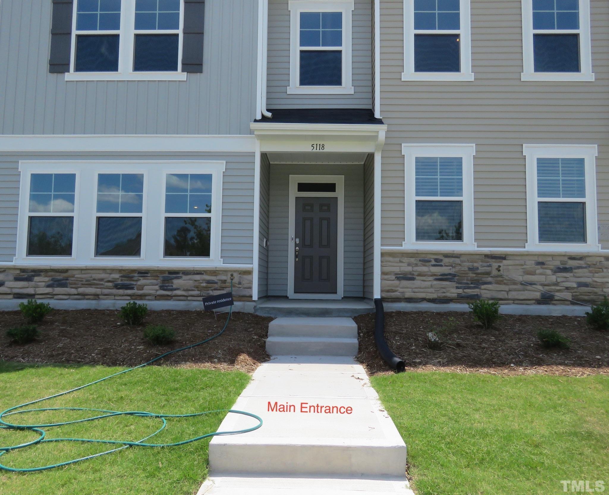 5118 Anamosa Street Raleigh, NC 27610 - Photo 25 of 36 a white house with yard in front of it