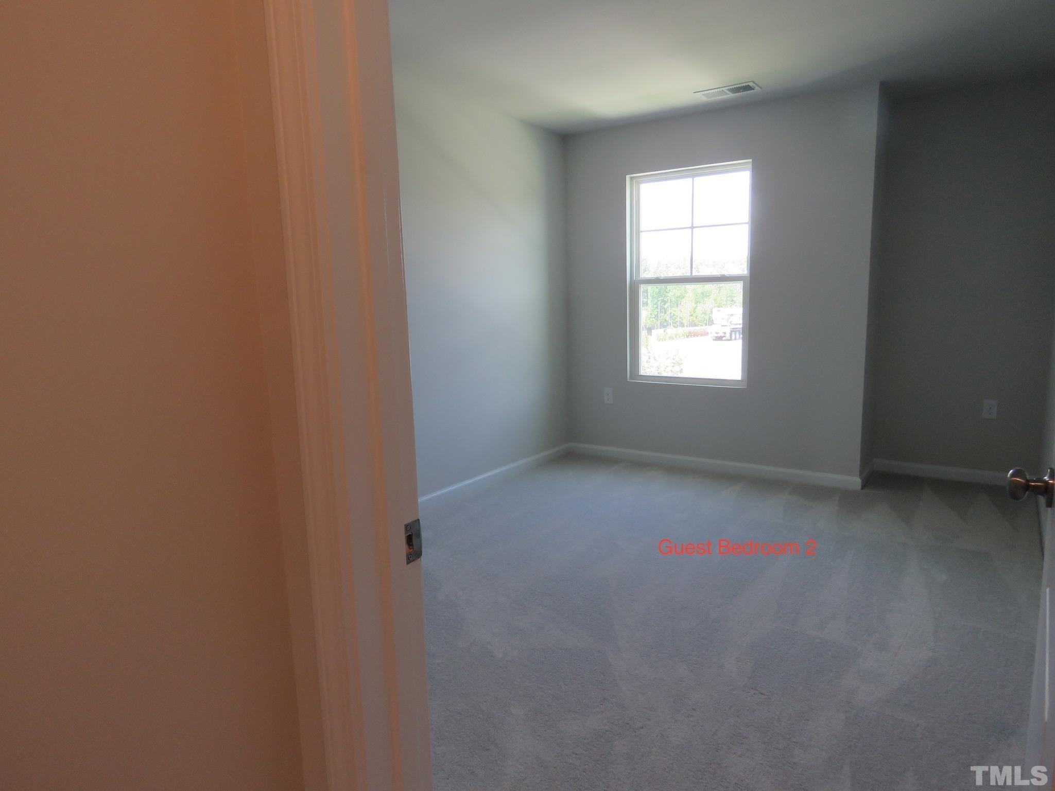 5118 Anamosa Street Raleigh, NC 27610 - Photo 32 of 36 an empty room with a window