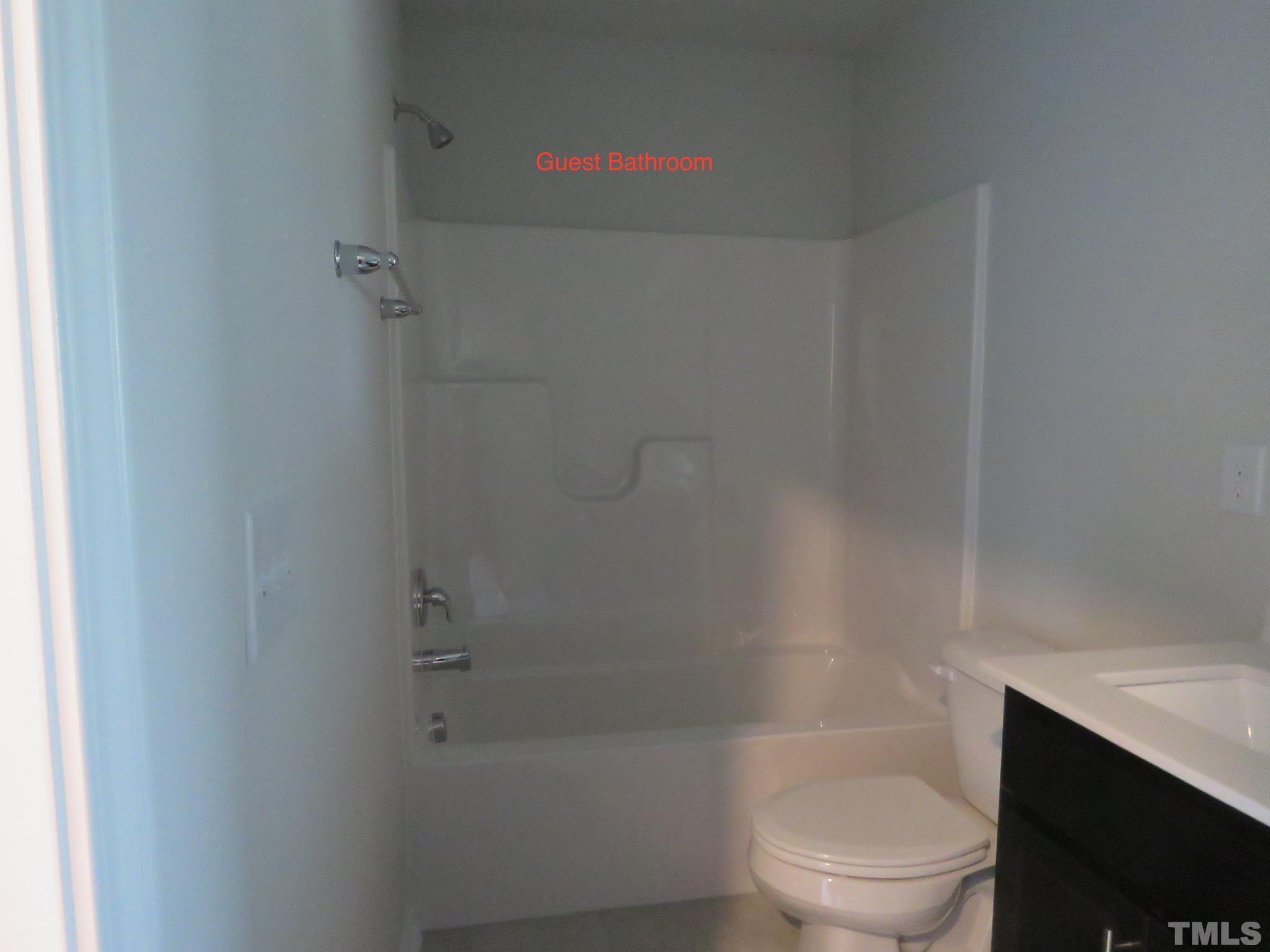 5118 Anamosa Street Raleigh, NC 27610 - Photo 33 of 36 a bathroom with a toilet and shower