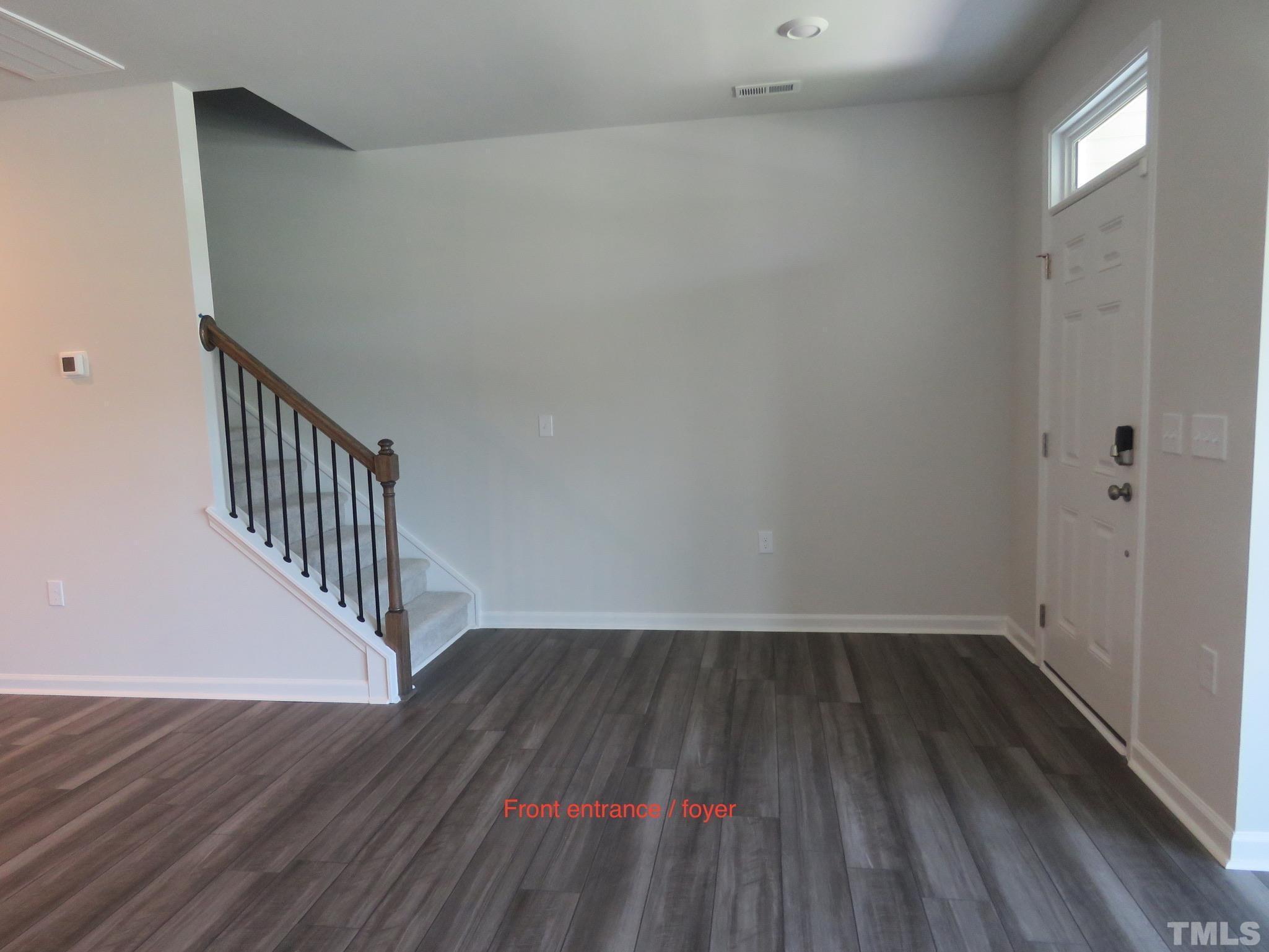 5118 Anamosa Street Raleigh, NC 27610 - Photo 36 of 36 a view of hallway with wooden floor