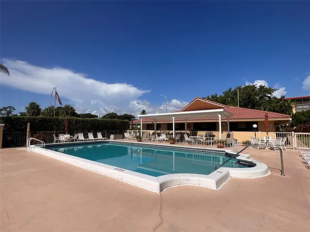 a house view with a sitting space and garden space