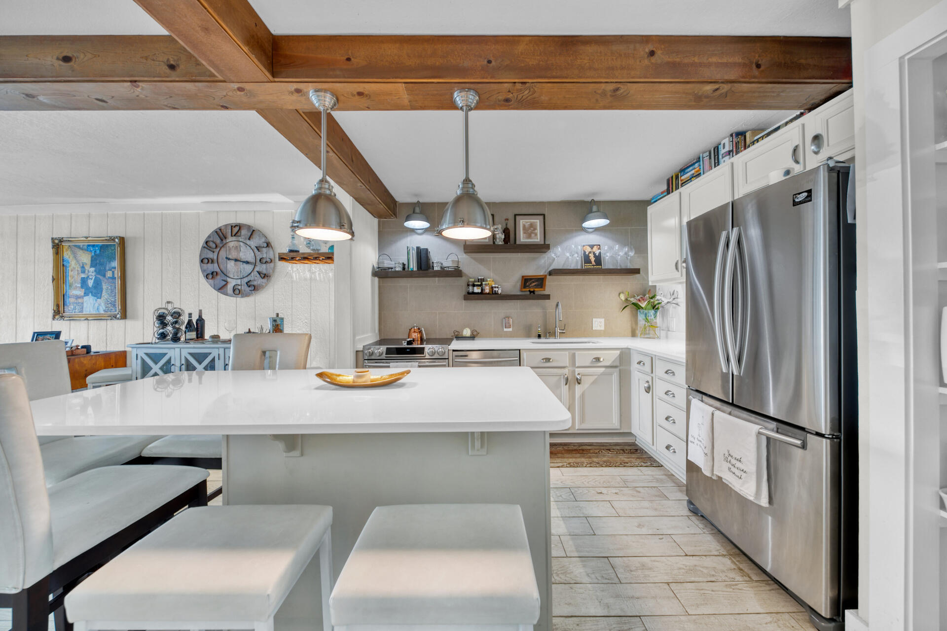 a kitchen with counter top space and stainless steel appliances