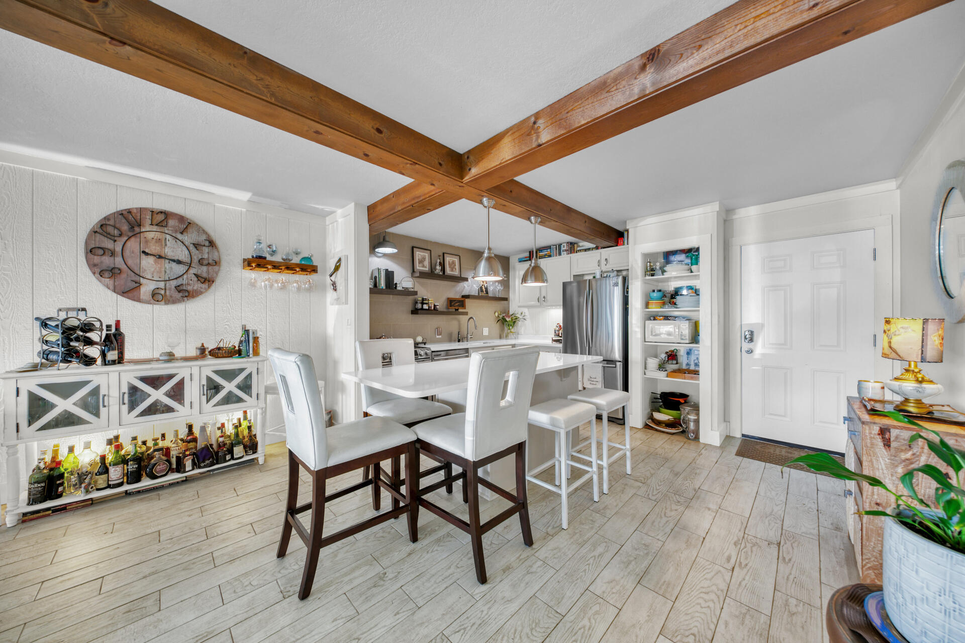 30 Moreno Point Road, Unit 101A Destin, FL 32541 - Photo 2 of 25 a view of a dining room with furniture and wooden floor