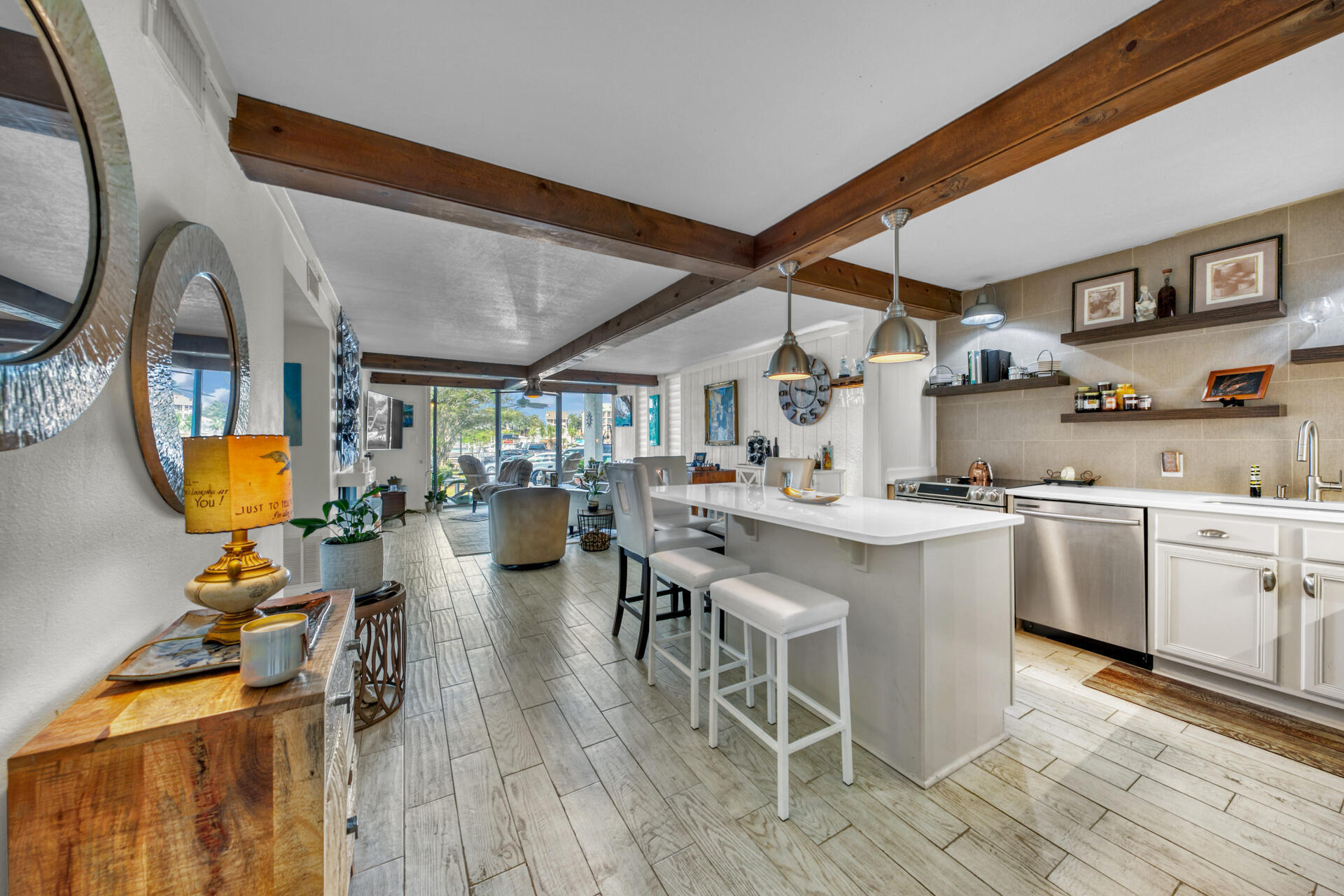 30 Moreno Point Road, Unit 101A Destin, FL 32541 - Photo 4 of 25 a kitchen with a sink appliances and cabinets