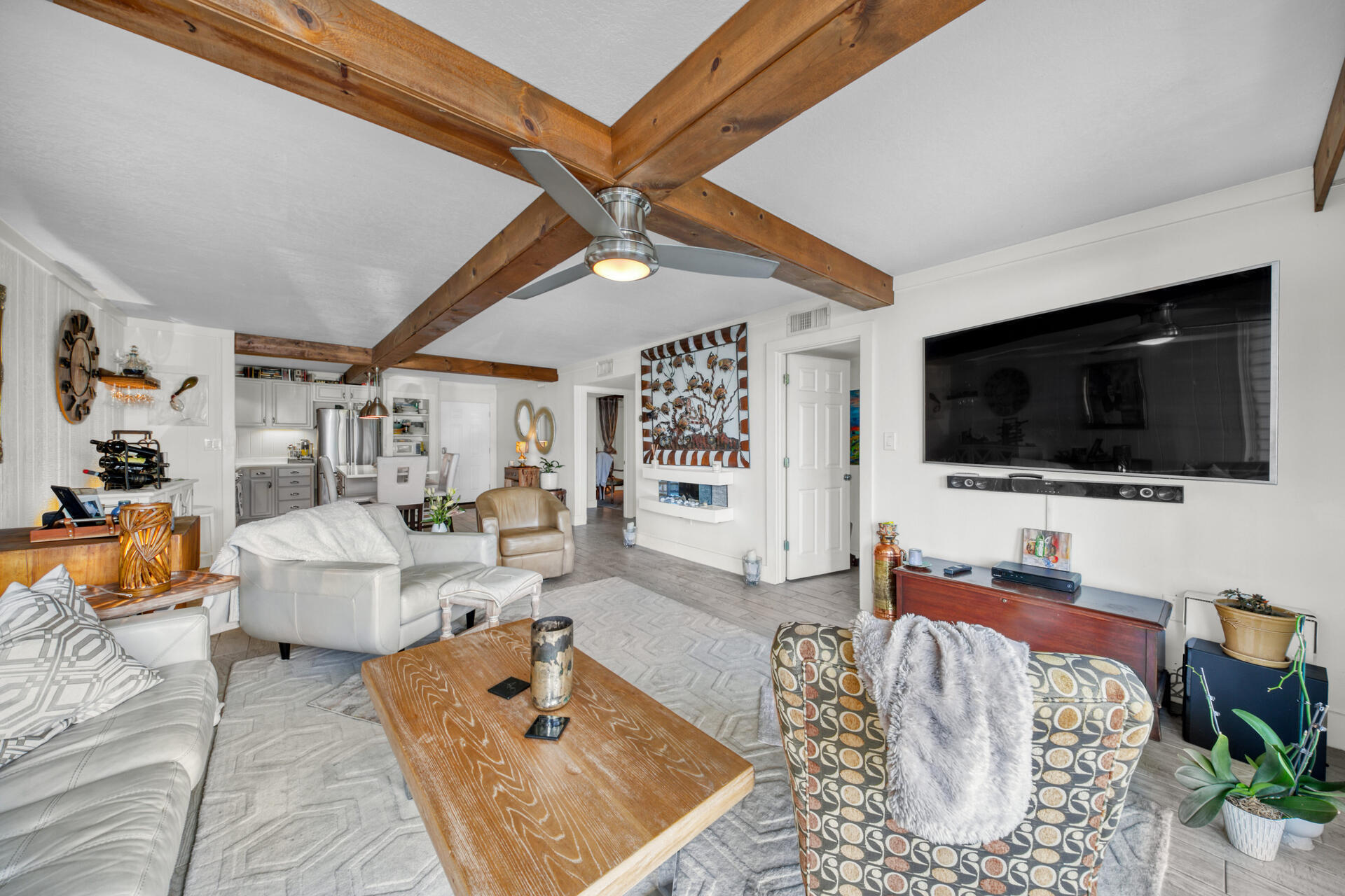 30 Moreno Point Road, Unit 101A Destin, FL 32541 - Photo 6 of 25 a living room with furniture and a flat screen tv