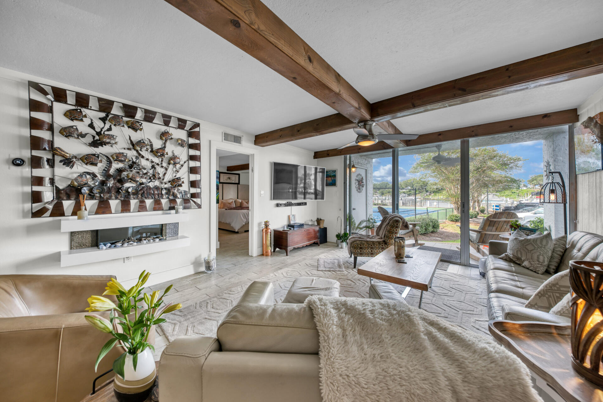 30 Moreno Point Road, Unit 101A Destin, FL 32541 - Photo 8 of 25 a living room with furniture and a large window