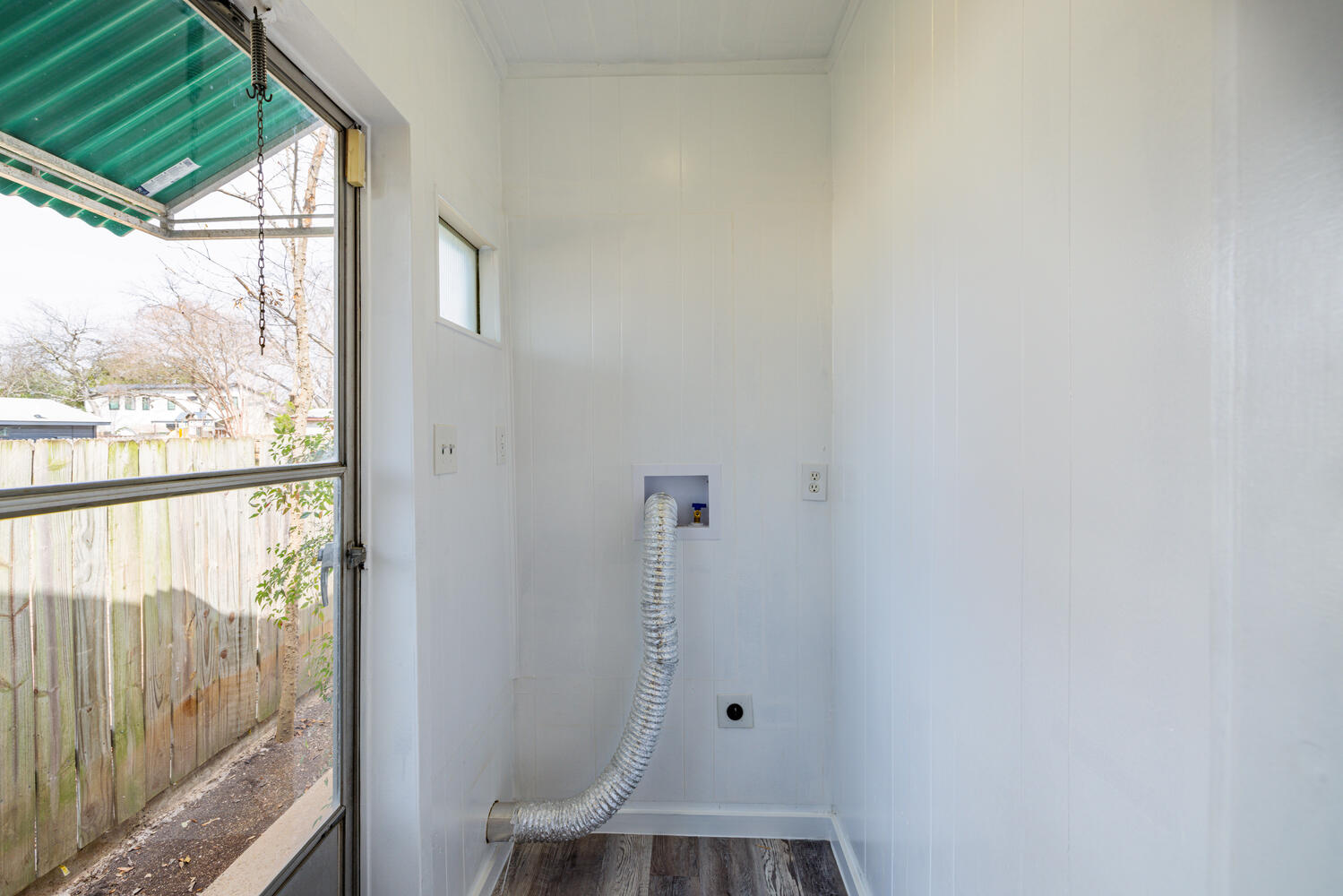 1400 Ruth Avenue Austin, TX 78757 - Photo 13 of 29 A dedicated utility space features durable flooring and convenient exterior door access.