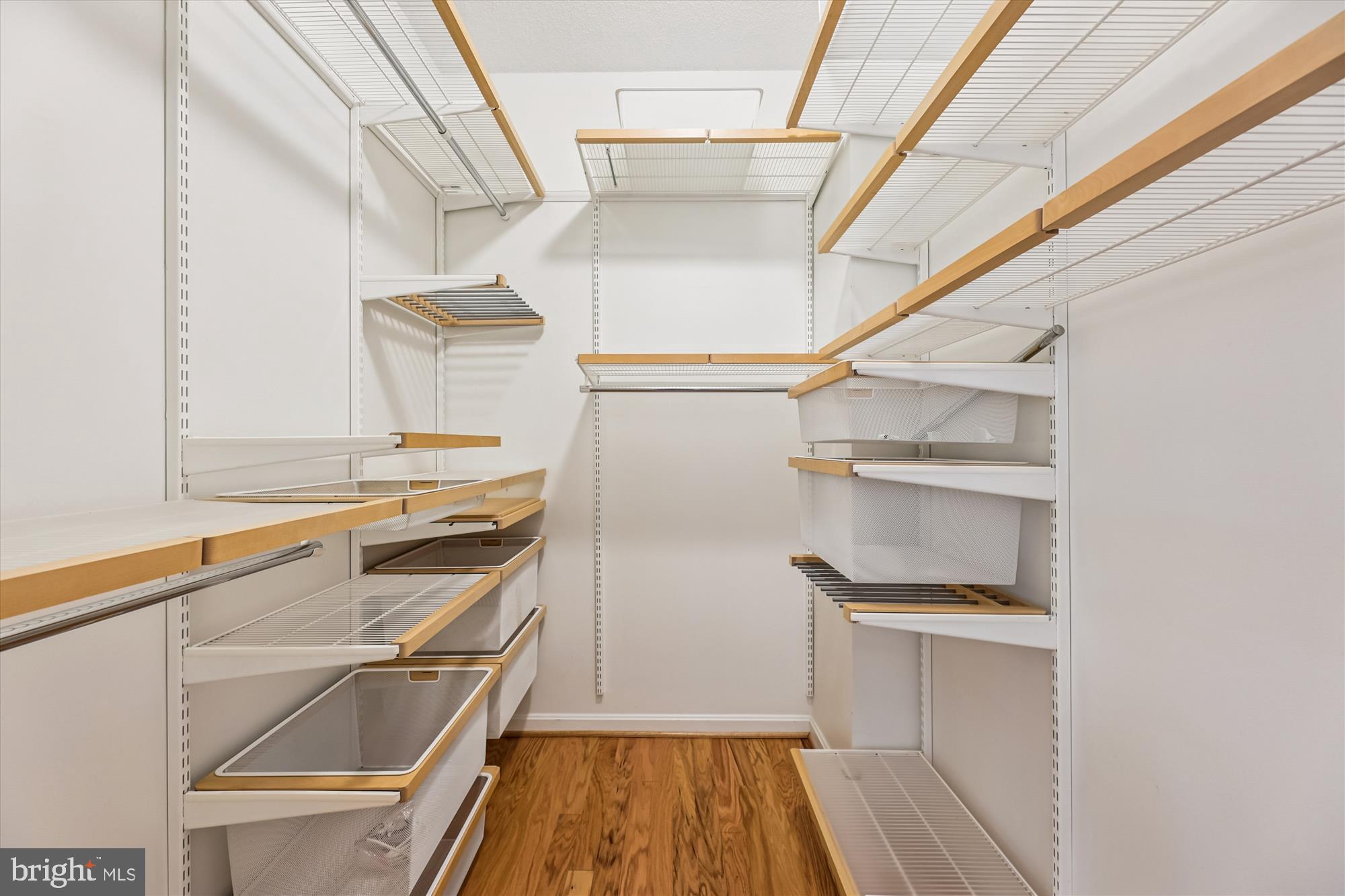 1390 Kenyon Street Northwest, Unit 416 Washington, DC 20010 - Photo 12 of 58 a kitchen with white cabinets and a stove