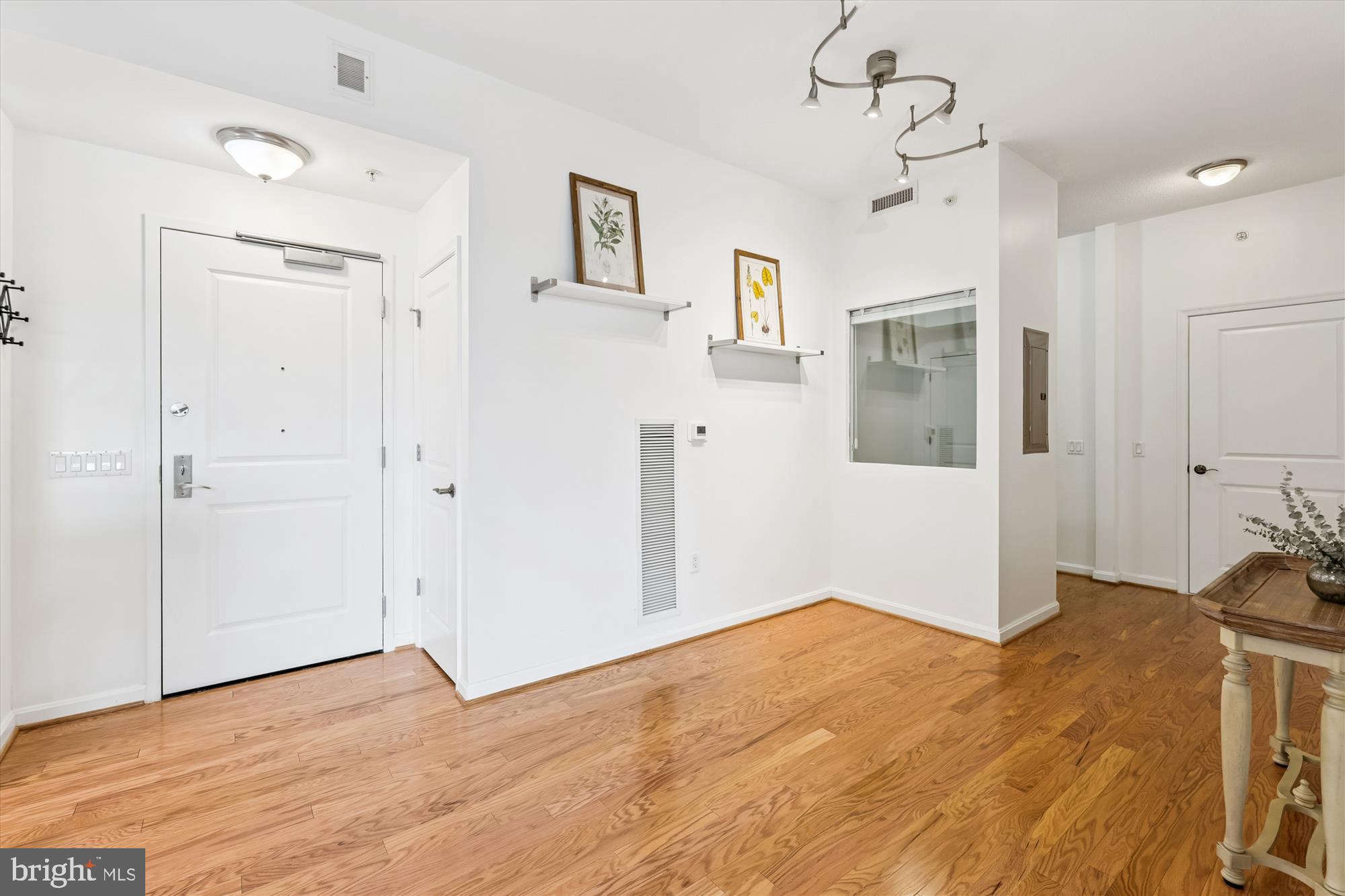 1390 Kenyon Street Northwest, Unit 416 Washington, DC 20010 - Photo 2 of 58 a view of empty room with wooden floor