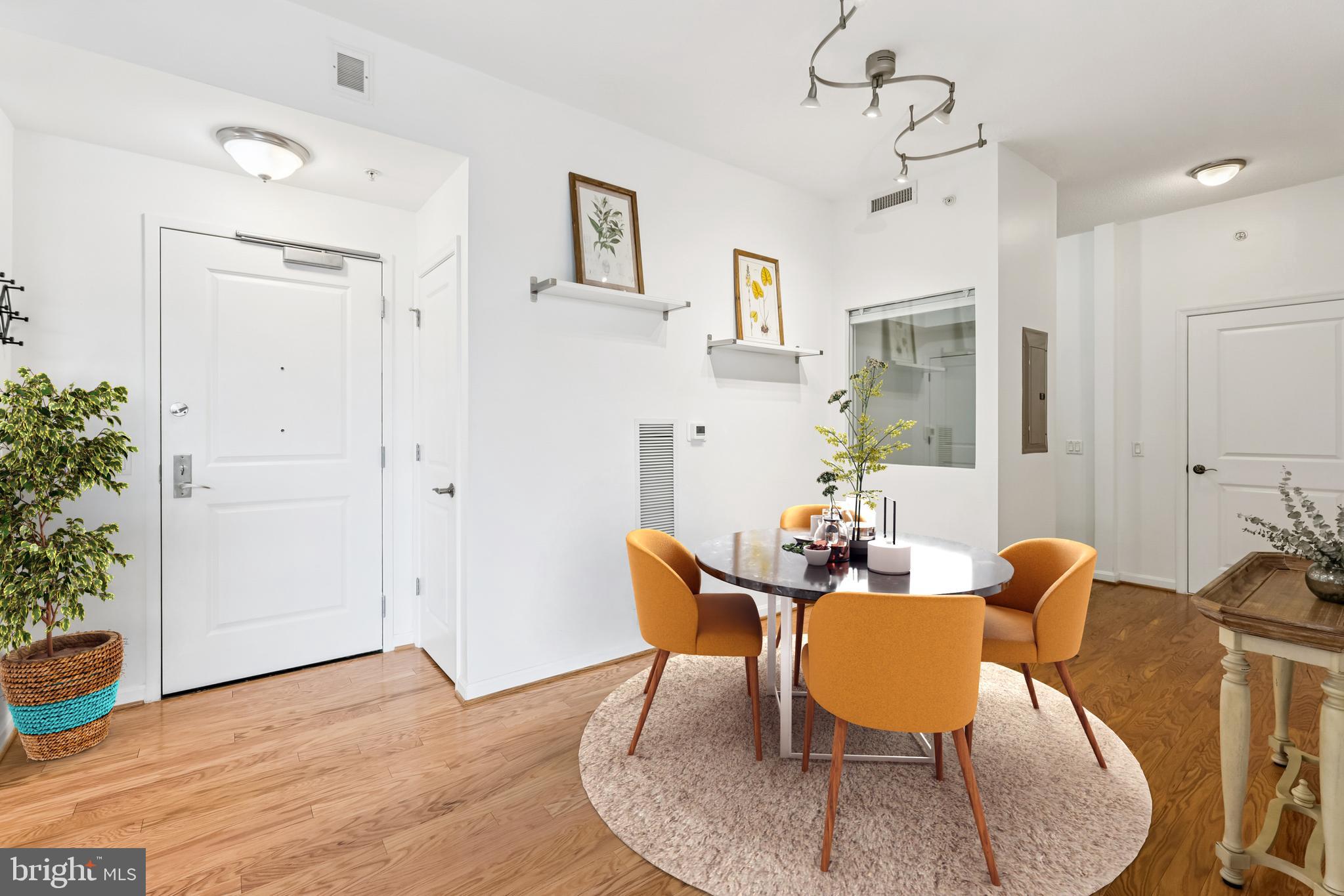 1390 Kenyon Street Northwest, Unit 416 Washington, DC 20010 - Photo 3 of 58 a dining room with furniture and window